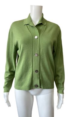 "This is a great green knitted cardigan dating from the 1950's. It has a small collar and  mother of Pearl buttons. The condition is good. There are a few tiny repairs. These can be found on the collar, not visible when worn and on the front side. Bust approx 36\"-38\" Length from nape of neck 22\" Arm length from under armpit 15\" Shoulder seam to shoulder seam 15\"" Classic Fitted Green Polo Sweater, Fitted Classic Green Polo Sweater, Green Fitted Classic Polo Sweater, Classic Green Long Sleeve Cardigan, Classic Fitted Green Cardigan, Green Button-up Sweater, Vintage Green Long Sleeve Cardigan, Vintage Green Cardigan With Button Closure, Green Vintage Cardigan With Buttons