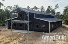 an image of a house that is in the middle of dirt and trees behind it