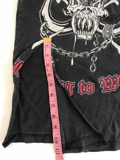 This was a men's Metallica Fan Club tee that was reworked into a small women's tank. It's one of a kind. There is a rip in the lower front that was used to tie the bottom of the shirt with. I've provided measurements in the photos for an accurate fit. It's the perfect true vintage Metallica fan tee to partner with your trashed hi rise 90's jeans and your docs. And it's already reworked and custom cut ⚡️ (14) Fitted Sleeveless Grunge T-shirt, Edgy Graphic Print Muscle Tee For Streetwear, Fitted Muscle Tee Tank For Streetwear, Stretch Grunge Tank Tops, Grunge Stretch Tank Tops, Alternative Cotton Tank Top For Concerts, Alternative Style Cotton Tank Top For Concerts, Stretch Tank Tops In Grunge Style, Punk Streetwear Stretch Tank Top