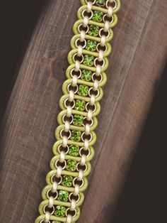 This bracelet is made from gold rolo chain, green leather and green rhinestone. Instead of the leather pull closure that you normally see on this type of bracelet, it has a nice magnetic clasp that is fashionable and secure.  This bracelet is 7 inches in length but can be ordered and made at various lengths. Shop LindaBlissJewelry on Etsy: https://www.etsy.com/shop/LindaBlissJewelry Green Bracelet With Lobster Clasp, Elegant Green Chain Bracelet, Adjustable Green Metal Bracelets, Green Chain Bracelet Jewelry, Green Metal Chain Jewelry, Gold Bracelet For Women, Gold Bracelet Chain, Rolo Chain, Leather Pulls