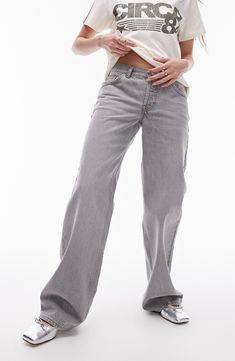 Low-slung nonstretch jeans are cut with puddling cuffs and turned to a dreamy shade of ultralight grey. 30" inseam; 21" leg opening; 10" front rise; 13 1/2" back rise (size 32) Zip fly with button closure Five-pocket style 100% cotton Machine wash, line dry Made in Turkey Gray Flare Jeans With Five Pockets, Spring Gray Denim Flare Jeans, Spring Gray Flare Denim Jeans, Spring Gray Washed Jeans, Mid-rise Washed Gray Bottoms, Washed Mid-rise Gray Bottoms, Gray Jeans With Five Pockets For Spring, Gray Five-pockets Jeans For Spring, Gray Washed Mid-rise Bottoms