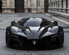 a black and white sports car parked in front of a building