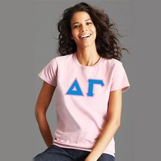 a woman sitting on top of a stool smiling