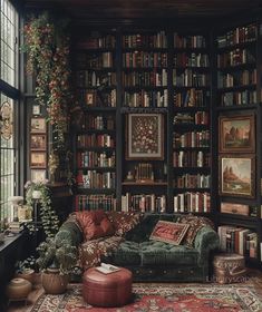 a living room filled with lots of books and furniture