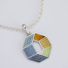 "Necklace also can be combined with the same design earrings https://www.etsy.com/listing/1109652373/grey-yellow-octagon-earrings-cloisonne?ref=shop_home_active_2&frs=1 Weight - 4 gr (approx) Length - 30 mm/1.18\" (including pendant bail) Width - 20 mm/0.78\" Materials: Sterling Silver, Fine Silver, Cloisonne enamel, silver chain 50cm Octagon yellow/grey pendant made from Sterling Silver. 50 cm (20inch) silver cable neck chain with lobster claw closure. Pendant covered with hot cloisonne enamel. Handmade Gray Metal Jewelry, Gray Metal Jewelry For Gifts, Gray Metal Jewelry For Gift, Gray Pendant Jewelry For Gifts, Gray Pendant Jewelry As A Gift, Handmade Hexagonal Silver Jewelry, Silver Hexagon Necklace For Jewelry Making, Crow Jewelry, Crow Pendant