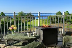 a fire pit sitting on top of a wooden deck