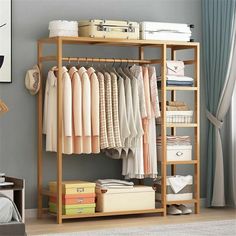 an organized closet with clothes and suitcases