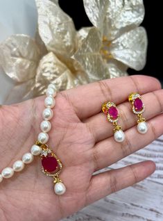 Beautiful Original Fresh PearlNecklace Ruby Emerald Green Stone AD Set,Fresh Water Pearls Necklace,Hyderabadi pearls Mala necklace set.Mother's Day Gift. 💕 Comes with the necklace and earring💕 High End Quality 100% Satisfaction Guarantee: Long Lasting Plating, High-Quality Stones. Colors Available- - Ruby -Emerald Green DISPLAY BOX IS AN ADDITIONAL $5. Perfect for any occassion-Shagun, Jago, sangeet, engagement, pre-wedding and parties.   Care: It is advisable that you keep our products away f Pearl Drop Jewelry Sets For Diwali Gift, Pearl Necklace For Diwali Gift, Pearl Jewelry Sets For Diwali Gift, Diwali Gift Pearl Jewelry Sets, Diwali Bridal Necklace With Pearl Drop As Gift, Festive Pearl Drop Jewelry Sets Gift, Pearl Kundan Necklace For Gift, Festive Pearl Chain Jewelry Sets Gift, Kundan Necklace With Pearl Drop For Gift