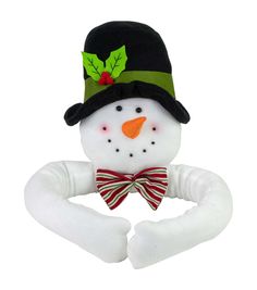 a snowman wearing a green hat and bow tie with his hands in the air