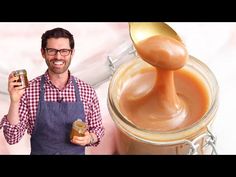 a man holding a jar of peanut butter next to a jar of caramel sauce