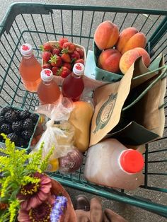 a shopping cart filled with fruit and drinks