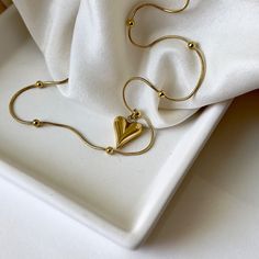 This exquisite A Heart of Gold Necklace is the ultimate token of affection. Crafted from hypoallergenic materials and dipped in 18k gold, this dainty and feminine jewelry piece is a luxurious treat for any woman. With its lightweight design, it'll be just the perfect gift for any special occasion. ☆Waterproof gold neck Luxury Dainty Chain Necklace As Gift, Luxury Gold Plated Necklace For Valentine's Day, Luxury Dainty Heart Jewelry, Luxury Delicate Jewelry For Valentine's Day, Luxury Jewelry For Women For Mother's Day, Delicate Luxury Gold Jewelry, Luxury Graceful Jewelry For Gift, Luxury Handmade Jewelry As A Gift For Her, Luxury Handmade Jewelry For Gift