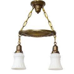 two light chandelier with white glass shades and gold chain hanging from the ceiling