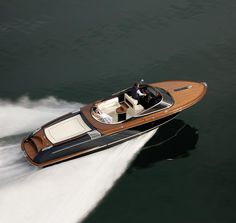 a small motor boat speeding across the water