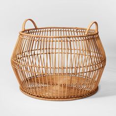 a wicker basket sitting on top of a white table