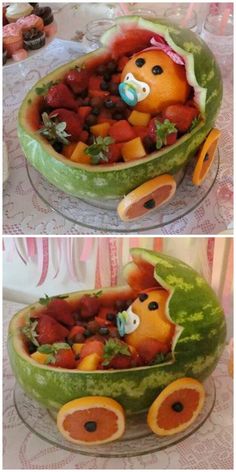 there is a watermelon boat filled with fruits and vegetables in the shape of animals