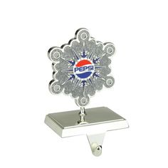 a pepsi bottle opener is shown on a metal holder with an ice flaker in the center