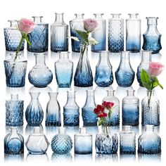 many different vases with flowers in them and one is blue, the other has pink roses