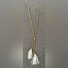 Gold Chain. White Bead Tassel. Worn Once, Looks Completely New. The Photo Is To Give You An Idea Of The Length. Elegant Adjustable Tassel Necklace For Beach, White Beaded Chain Lariat Necklace, White Lariat Necklace With Beaded Chain, Adjustable White Beaded Lariat Necklace, White Adjustable Lariat Beaded Necklace, Adjustable White Tassel Necklace, White Beaded Necklaces With Tassels For Gift, White Beaded Necklaces With Tassels As Gift, White Beaded Tassel Necklaces As Gift