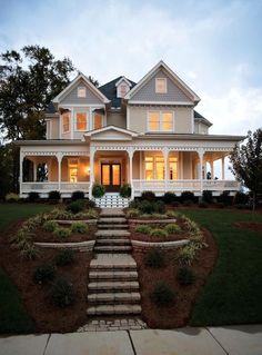 a large white house with steps leading up to it