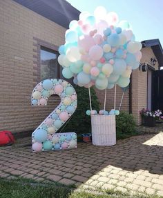 balloons are in the shape of the number twenty two