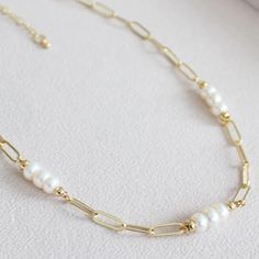 This Percy Pearl and 14k Gold Filled Paperclip chain necklace is the perfect piece to make a statement, but keep it low key. Crafted with nugget pearls, this subtle yet classy piece will be sure to turn heads. Upgrade your everyday style and your classic jewelry collection today!     * - 14K Gold Filled Paperclip chain with 5-6mm Freshwater nugget Pearls.    * -Each piece is handmade and pearls will differ in size, shape and colour slightly as they are naturally occurring.    * - 18 inch chain w Paperclip Necklace With Pendant, Classic Wedding Necklace With Paperclip Chain, Modern Pearl Jewelry Necklace, Chain And Pearl Necklace, Modern Pearl Jewelry, Diy Pearl Necklace, Real Pearl Bracelet, Chain Necklace Diy, Gold Pearl Jewelry