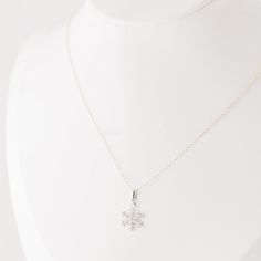 This stunning Silver Snowflake Necklace is a must-have for any winter lover! The delicate and dainty snowflake design adds a touch of elegance to any outfit, making it the perfect accessory for the holiday season. Show off your unique style with this minimalist piece of jewelry, which is sure to make a statement and turn heads. Treat yourself or a loved one to this beautiful Winter Necklace today! • Material: High Quality Sterling Silver 925• Featuring a 10mm Snowflake with chain 16 inches• Waterproof Jewelry• Nickel Free Snow Necklace, Winter Necklace, Snowflake Necklace, Snowflake Design, Silver Snowflakes, Waterproof Jewelry, Outfit Making, Snowflake Designs, Holiday Jewelry