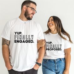 two people wearing t - shirts that say yup finally engaged and yup finally proposed