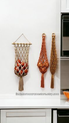 there are three different types of macrame hanging on the wall in this kitchen