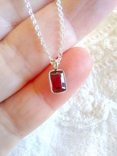 "Sterling Silver Dainty garnet Necklace, birthstone necklace. Size shown is 16\". Please choose your favorite necklace length at checkout. All lengths have a one inch extender, that way you'll have some wiggle room to play with the length. For example, if you choose a 14 inches necklace length, you'll have options to close the necklace at any length between 14 inches and 15 inches.  Some of this charms are sold by themselves (no chain). If that option is available for this, you will have the option to buy \"CHARM ONLY\" before adding the item to the cart. Normally, a 3 mm ring made out of the same material is attached to the charm. If you own a chain and plan to use the charm for it, ensure that the 3 mm ring will pass through, or you have a bigger ring if needed, and/or you know how to op Red Sterling Silver Jewelry As Gift For Mom, Red Sterling Silver Jewelry For Mom, Garnet Birthstone Jewelry Gift, Dainty Red Birthstone Necklace For Gift, Faceted Birthstone Necklace In Sterling Silver As Gift, Red Dainty Birthstone Necklace, Gift Faceted Birthstone Necklace In Sterling Silver, Dainty Garnet Jewelry For Gifts, Ruby Gemstone Birthstone Necklace Gift