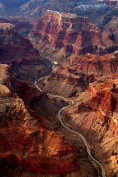 an aerial view of the grand canyons and rivers in the desert, with blue water running through them