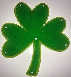 a green plastic shamrock with white dots on it