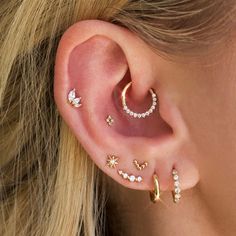 a close up of a person with ear piercings on their left and right sides