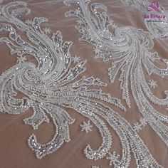 Price: The price is for 1 yard. if you buy more than 1 yard ,it won't be cut. will come in one piece the longest is 20 yards. Material: polyester,sequins,beads Fixed Wide : 100cm or 36 inches. color:silver Want to see other colors and more similar Beading lace fabrics come to: https://www.etsy.com/shop/Randyfabrics?ref=hdr_shop_menu&section_id=14192305 Shipping: Choose the shipping way you need, if you want package shipped by express,please note the phone number on order. Use for Dress,cloth Elegant Silver Embroidered Fabric With Lace Work, Elegant Silver Lace With Sequins, Elegant Silver Lace With Intricate Embroidery, Elegant Silver Lace Embroidered Fabric, Elegant Silver Embroidered Lace Fabric, Elegant Silver Lace Tulle Fabric, Elegant Silver Lace With Lace Work, Embellished Silver Lace Tulle Fabric, Silver Embellished Lace Tulle Fabric