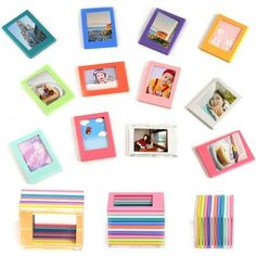 there are many different colored frames on the table together, including one with a baby's picture