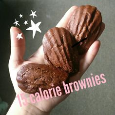 a hand holding two chocolate brownies in it's palm with stars on the background