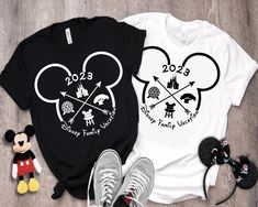 two shirts with mickey mouse heads on them, one is black and the other is white