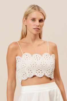 WHITE LACE TOP  FEATURES    * Eyelet lace   * Cropped   * Adjustable straps   * Model wears a size small    * This style runs a little big!    * Pair with your favorite pair of bottoms  🤍  GARMENT CARE  Each item we make is produced and handled with care. We encourage you to consider the environment when cleaning our items.  We recommend you dry clean this product and spot clean. Eyelet Lace Top, Slouchy Shirt, White Lace Crop Top, Gauze Skirts, Eyelet Skirt, Eyelet Top, White Lace Top, Denim Maxi Skirt, Large Dress