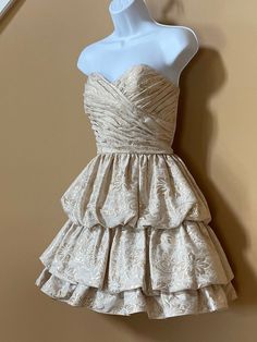 Vintage Betsey Johnson dress. Cream/gold colored with ruching, tiered skirt, strapless formal gown. Women's size 8. Fitted Strapless Tiered Dress For Prom, Tiered Strapless Cocktail Dress, Fitted Tiered Strapless Dress For Evening, Gold Ruched Wedding Dress, Formal Strapless Dress With Ruffles, Fitted Gold Strapless Dress For Prom Season, Gold Strapless Dress For Prom Season, Elegant Gold Strapless Dress For Wedding, Elegant Gold Strapless Wedding Dress