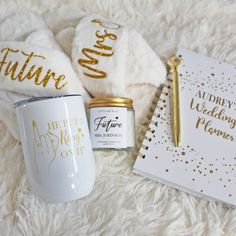 the contents of a personalized wedding gift laid out on a white blanket