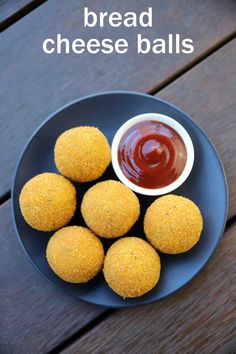 breaded cheese balls on a blue plate with ketchup