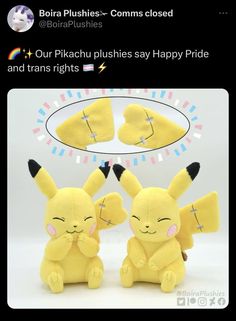 two stuffed pikachu plushies sitting next to each other