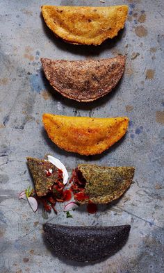 four different types of food on a table