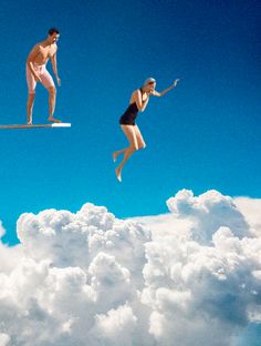 two people jumping in the air on surfboards above clouds and blue sky with white puffy clouds