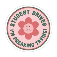 a sticker with the words student driver, i'm freaking trying on it