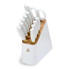 a knife block with many knives in it