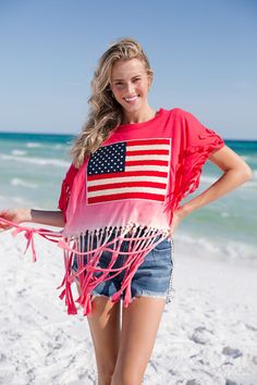 The LIBERTY TIE DYE FRINGE TEE is the perfect summertime look. Oversized for added comfort, this tee features lightweight fringe and tie-dye colors in both red and navy. Add the perfect touch to your 4th of July outfit with this festive and stylish look. All orders are currently shipping within 14 business days. To receive item quicker, expedited shipping is available at checkout. American Flag Print Cotton Top For Beach, American Flag Print Summer Beach Top, American Flag Print Beach Top For Summer, Short Sleeve Beach Tops With Frayed Hem, Frayed Hem Short Sleeve Tops For Beach, Beach Tops With Frayed Hem And Short Sleeves, Summer Tops For 4th Of July Vacation, Summer Tops For Vacation And 4th Of July, Summer Tops For Vacation On 4th Of July