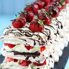 there are strawberries on top of the cake