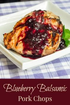 blueberry balsamic pork chops on a white plate