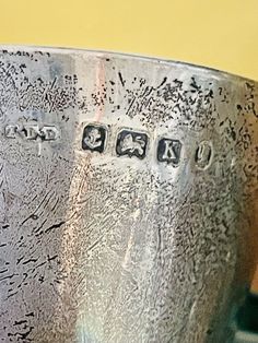 a close up of a metal bowl with writing on the side and numbers in it